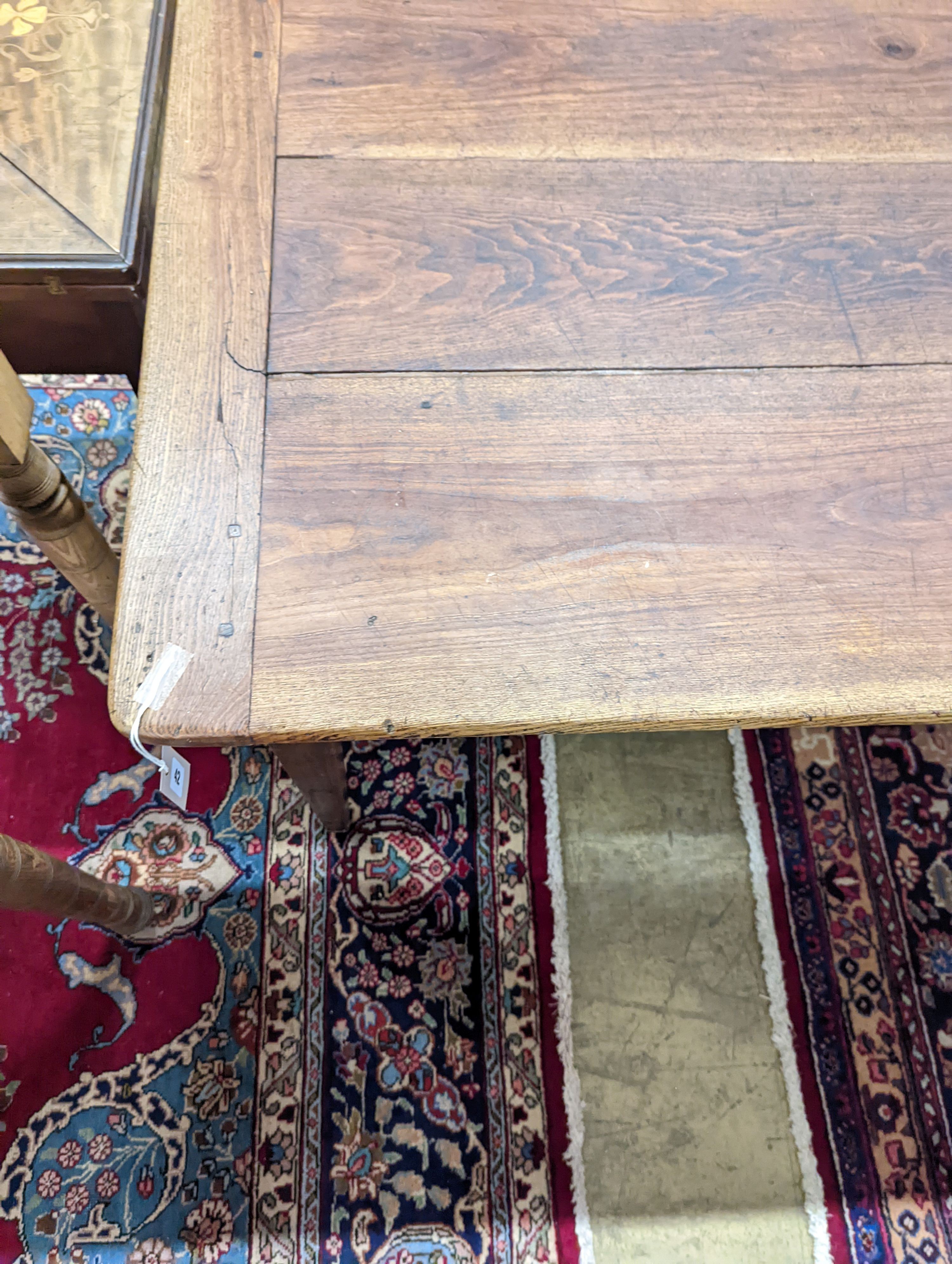 A 19th century French rectangular oak kitchen table. W-153cm, D-75cm, H-73cm.